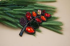 This red crystal brooch is created in the form of the leaf in the shadows of red and orange. Our botanical crystal jewelry is made of premium crystals and glass beads. The leaf brooch pin can be worn as a jacket or coat brooch. These nature glass accessories are sparkling, unique and fashionable.This red  crystal brooch is a glamorous accessory to jazz any casual or evening look. Our crystal brooch will be a perfect birthday gift for any special women in your life - mother, sister, girlfriend, e Elegant Leaf-shaped Brooches For Gifts, Handmade Elegant Red Brooches, Elegant Handmade Red Brooches, Elegant Red Handmade Brooches, Rhinestone Ear Cuff, Bridesmaid Hair Clips, Orange Crystals, Dog Jewelry, Botanical Jewelry