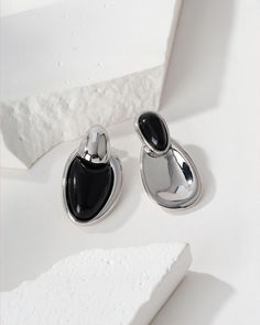 Our Onyx Silver Stud Earrings are the perfect blend of natural gemstones and unique style. Featuring the powerful Onyx gemstone, these earrings infuse the wearer with confidence and protective energy. Onyx has been praised for its ability to enhance emotional stability and resilience, making these earrings not only a fashion statement, but also a symbol of inner strength and perseverance. Designed to showcase a striking asymmetrical aesthetic, these earrings add a touch of individuality and mode Asymmetrical Aesthetic, Protective Energy, Perfume Jewelry, Emotional Stability, Onyx Gemstone, Silver Stud Earrings, Inner Strength, Silver Earrings Studs, Silver Studs