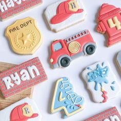 decorated cookies are arranged on a white surface