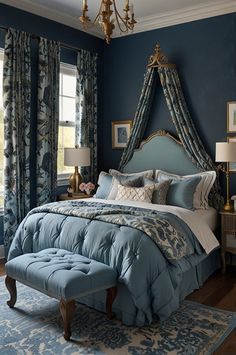 a bedroom with blue walls and curtains on the windowsills, a large bed in front of a chandelier