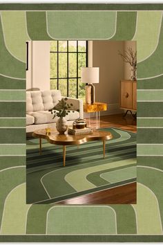 a living room filled with furniture and a green rug on top of a hard wood floor