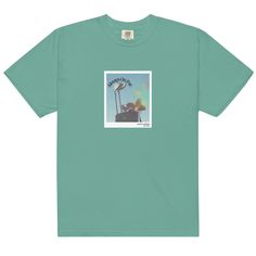 a green t - shirt with an image of a street light