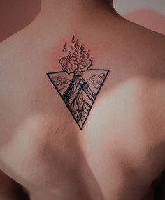 the back of a woman's shoulder with a tattoo on it