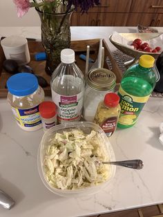 a table topped with lots of different types of food and condiments on top of it