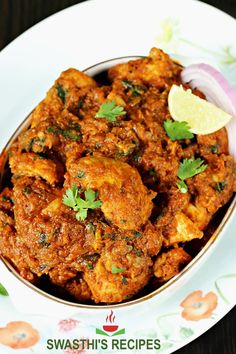 a bowl filled with chicken and garnished with cilantro