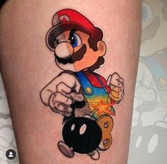 a person with a nintendo mario tattoo on their leg, holding a bowling ball and pointing to the side