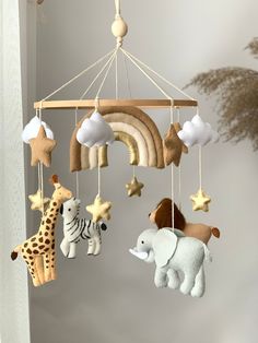 a mobile with animals and stars hanging from it