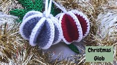 three christmas ornaments hanging from a tree