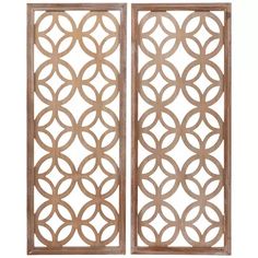 two wooden screens with circular designs on the sides and one is open to reveal an intricate design