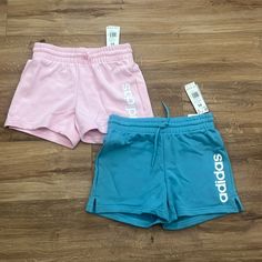 These Are Two Brand New Pairs Of Adidas Shorts! They Are Both A Size Xs With A An Adjustable Tie Around The Waist! They Are Pink And Blue And Will Be Sold Together! There Is No Liner Inside, They Are A Soft Cloth Like Shorts! Adidas Cotton Bottoms With Built-in Shorts, Trendy Adidas Bottoms For Summer, Trendy Adidas Bottoms For Spring, Adidas Pink Shorts For Spring, Adidas Shorts With Pockets For Spring, Pink Adidas Shorts For Sports, Pink Stretch Adidas Bottoms, Adidas Pink Shorts For Sports, Adidas Pink Bottoms For Summer