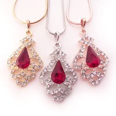 "Elegant Victorian inspired drop earrings, pendant, or necklace set with ruby red Swarovski crystal center jewels bordered by swirls of pave set clear diamante. The metal is nickel-free with your choice of rose gold, silver, or gold plating. The earrings are 2\" (5 cm) long and .8\" (2cm) wide. The pendant is 1.5\" long on a chain that is adjustable from 16\"-18\" long. Ships quickly in a free gift box! I stock Swarovski crystals in the full rainbow of colors and can customize this design in man 1920s Prom, Victorian Wedding Jewelry, Mint Green Jewelry, Full Rainbow, Swarovski Pendant, Wedding Jewelry Set, Yellow Jewelry, Victorian Wedding, Crystal Pendant Necklace