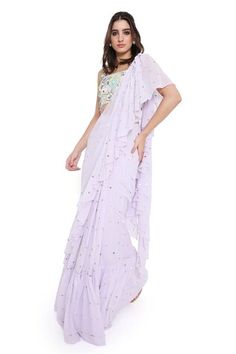 Lavender pre-draped mukaish work ruffled saree. Paired with a floral applique work blouse. - Aza Fashions Summer Festive Pre-draped Saree With Ruffles, Summer Georgette Saree With Ruffles, Summer Wedding Pre-draped Saree With Ruffles, Summer Wedding Pre-draped Ruffled Saree, Spring Elegant Georgette Pre-draped Saree, Fitted Georgette Pre-draped Saree For Spring, Elegant Spring Georgette Pre-draped Saree, Elegant Georgette Pre-draped Saree For Spring, Elegant Pre-draped Georgette Saree For Spring