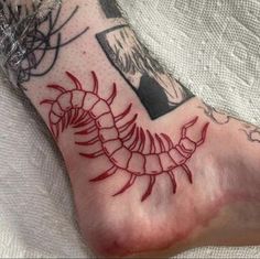 a person with a tattoo on their foot