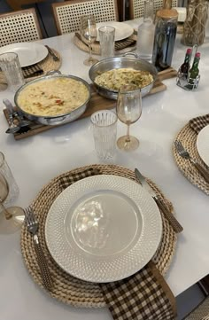 the table is set with plates and silverware