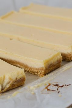 there are several pieces of cake on the counter ready to be cut into squares and served