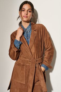 With its breezy open front and hand-sewn whipstitching details, the western-inspired Laura suede wrap coat offers a unique and lightweight style for cool-weather months. Crafted from durable sueded goatskin leather with a wonderfully soft hand, this unlined coat features snakeskin print on the inside, a classic notch collar, and two front patch pockets. The removable soft-tie belt creates a flattering and flexible silhouette. Western Style Suede Winter Outerwear, Western Suede Outerwear For Winter, Fall Suede Belted Outerwear, Brown Suede Outerwear For Spring, Belted Wrap Coat, Jacket Cape, Capes & Ponchos, Sheepskin Slippers, Sheepskin Coat