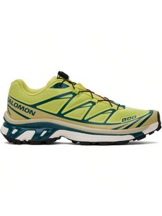 the salloni running shoe is yellow and blue with black detailing on the upper part