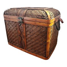 an old wooden trunk with wicker and leather straps on the top, isolated against a white background