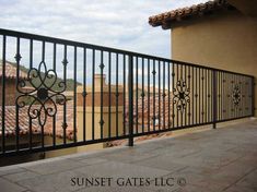 an iron balcony railing on top of a building