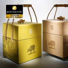 two wooden boxes with animals on them, one is yellow and the other is brown