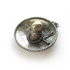 "Cute Mexican Sombrero bracelet charm is highly detailed with carved flowers. It has twisted rope detail around the brim and the hat band. The word MEXICO can be seen running across the crown of the hat. It has silver marks on the underside. Hat charm measures 1\" in diameter. It can be worn on a bracelet or as a pendant. Thanks for looking! vintagedame.etsy.com" Antique Adjustable Jewelry With Charms, Adjustable Charms Jewelry As Souvenir, Traditional Adjustable Charms Jewelry, Antique Adjustable Charms Jewelry, Adjustable Charms Jewelry Souvenir, Mexico Silver Jewelry, Taxco Silver Jewelry Mexico, Mexican Sombrero, Carved Flowers