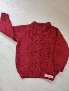 A warm cosy hand knitted Chunky Sweater, Jumper, Pullover, Cardigan.  Knitted in Chunky weight wool. A great present for that special little person boy or girl. The jumper is knitted in a traditional cable pattern Great little all round sweater or jumper for playing, walking and running wild for lively little toddlers. Classic round neck jumper in traditional cable pattern in Dark Red. Equally good  for smart or casual wear. Matching beanie hat with button  to compliment the jumper. Chest 56cm 2 Chocolate Handmade, Red Beanie, Cable Pattern, Kids Jumpers, Chunky Cable Knit, Pullover Cardigan, Cable Knit Jumper, Baby Hands, Sweater Pullover