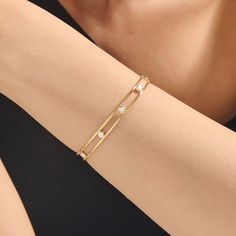 Upgrade your look with our Bezel Setting Double Wire Bubble Cuff. This exquisite bangle seamlessly marries classic elegance with contemporary flair. Its radiant gold bezel setting beautifully complements the dazzling stones, creating a captivating play of light. Whether you're dressing up for a special event or adding a touch of luxury to your everyday look, this bangle effortlessly combines timeless charm with modern allure. - Made in 14k solid gold - Decorated with handset white cubic zirconia Luxury Hand Set Cuff Bracelet, Timeless Formal Bangle With Single Diamond, Classic White Gold Cuff Bracelet For Everyday Luxury, Classic Diamond Cuff Bracelet With Hand-set Details, Diamond Bangle With Single Diamond For Wedding, Classic Diamond Cuff Bracelet With Hand Set Details, Single Diamond Bangle For Wedding, Wedding Bangle With Single Diamond, Classic Diamond Cuff Bracelet For Wedding