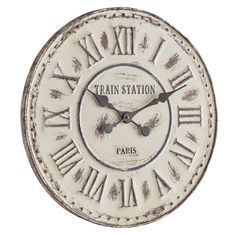 an old clock with the words train station paris on it's face and roman numerals