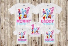 three shirts with the words mommy and baby in pink, blue and yellow on them