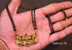 Beautiful one gram gold black bead chain with lakshmi devi motifs.   27 November 2019 Black Beads Long Chain Designs, Nallapusalu Designs Gold Long, Temple Jewellery Earrings, 15 February, Indian Wedding Jewelry Sets