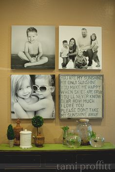 a shelf with pictures on it in front of a wall