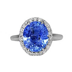 A Breathtakingly Striking  HANDMADE 14k White Gold Ring with Beautiful Oval cut Sapphire in Blue color! The GEM is 5.87 CT and measures 11.07x9.24x6.82 mm! This Stone will take your breath away, especially on the sunlight! You will want to look at this stone endlessly. The mounting is a masterpiece! HANDMADE 14K White Gold Mounting (tested), that was is custom made to Accommodate this Beauty of a Gem in Prongs setting! Super FINE Workmanship on the Diamond prong  setting with 22 pcs Brilliant Full Cut Diamonds in GH color, SI1 clarity, totaling to approx 0.38 ct ! Fabulous Braided Band and Diamond Gallery! The Entire Top's outline is 13.7x12.3 mm- HUGE. The Ring weights 5.3 g, nice and SOLID. Sits 8.2 mm off the top of the finger. Finger size 7 (Free Re-sizing with purchase). Center Stone: Oval Gemstones With Halo Setting For Formal Occasions, Luxury Oval Gemstones With Halo Setting, Oval Center Stone Gemstones For Formal Occasions, Oval Platinum Gemstone With Center Stone, Gia Certified Oval Sapphire Ring In Platinum, Classic Oval Gemstones With Halo Setting, Gia Certified Oval Diamond Ring Fine Jewelry, Luxury Oval Sapphire Ring With Brilliant Cut, Luxury Oval Platinum Gemstones