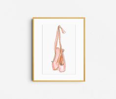 a watercolor drawing of two ballet shoes hanging on a wall in front of a white wall