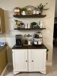 a coffee bar with two shelves above it