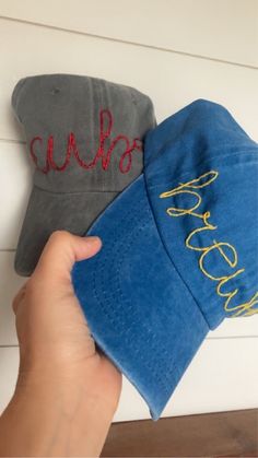 One size, unisex distressed baseball hats. A very simple stitch with the words Cubs and Brewers.  Hat colors are: Blue with gold lettering for the Brewers Gray with red lettering for the Cubs White with blue and gold lettering for the Brewers.  The hats that were worn are the hats that I made for myself and not the ones I will be selling. I wanted to showcase the lettering of each hat.   These hats come from a smoke and pet free home! Simple Stitch, Gold Lettering, Baseball Team, Gold Letters, Trucker Cap, Hand Embroidered, Caps Hats, Accessories Hats, Baseball Hats