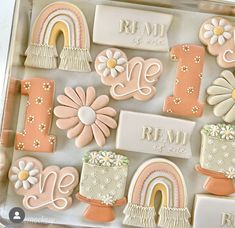 decorated cookies in the shape of letters and flowers