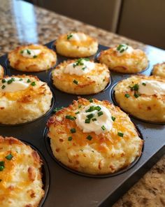 a muffin tin filled with mini cheesy potatoes