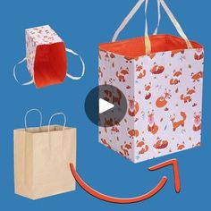 two shopping bags, one with an orange handle and the other with red handles