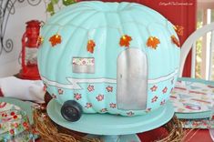 a blue pumpkin shaped like a camper on top of a table