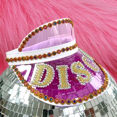 Elasticated pink, blue or rainbow sun visor embellished with rhinestones  Personalise the visor with a short word, name or initials Ibiza beach party accessories perfect for the bachelorette or hen party away Contact me for any specific personalisation requests One size fits all Adjustable Summer Hats With Bling, Trendy Summer Hats With Rhinestones, Summer Party Hats Embellished, Summer Party Embellished Hats, Pink Visor For Summer Beach, Pink Summer Beach Visor, Pink Summer Visor, Ibiza Beach Party, Beach Party Accessories