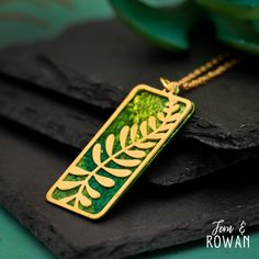 This Fern Leaf Pendant Necklace is a beautiful gift for those enchanted with nature! This Pendant features a Brass Fern Component and Brass disk that has been carefully handmade and painted in our studio. Ferns symbolizes invisibility, precognition, wealth, and love due to their ancient origins and unique reproductive process. It has an eye-catching appearance that would look great with any outfit! This "Mixed Metal" Pendant measures 53 mm in overall length, 48 mm in length and 23 mm in width. T Fern Necklace, Paint Brass, Botanical Jewelry, Colourful Necklace, Leaf Pendant, Bar Necklace, Special Gifts, Favorite Jewelry, Jewelry Necklace Pendant