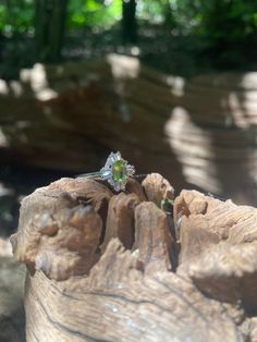 Art Deco sterling silver adjustable peridot ring. The peridot jewel measures 0.6 cm x 0.4 cm. Surrounded with crystals in an Art Deco pattern. Photo worn is the rose gold opal version for size reference. Comes in a black velvet cushioned box free of charge. Green Oval Topaz Ring In Sterling Silver, Green Topaz Sterling Silver Ring In Fine Jewelry Style, Green Topaz Sterling Silver Ring, Green Topaz Ring In Sterling Silver, Green Sterling Silver Crystal Ring With Center Stone, Green Crystal Ring With Center Stone In Sterling Silver, Green Sterling Silver Halo Ring With Prong Setting, Green Peridot Ring With Center Stone, Peridot Crystal Ring For Anniversary In May