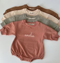 These sweatshirt bodysuits are ridiculously soft and have the perfect stretch. They're designed to have an oversized fit, keeping your little one cute and cozy! Runs true to size, but always size up if you're on the fence with sizing, or to achieve that extra oversized look! They're made to order using a commercial quality design process and made to last wash after wash without peeling, cracking or fading. Also available plain if you don't want a name added. CPSIA compliant PROCESSING & SHIPPING Cute Solid Color Playwear Bodysuit, Cute Solid Color Bodysuit For Playwear, Cute Soft Long Sleeve Onesie, Cute Long Sleeve Soft Onesie, Casual Long Sleeve Soft Onesie, Cotton Bodysuit For Loungewear, Casual Long Sleeve Onesie With Letter Print, White Long Sleeve Bubble Romper For Loungewear, Cute Long Sleeve Onesie With Letter Print