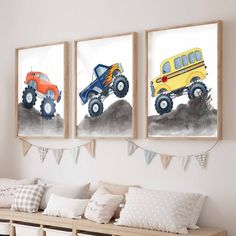 three paintings of trucks and cars hanging on the wall above a bench in a living room