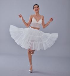 Step into elegance with our beautifully crafted voile petticoat. Designed to add volume and a touch of sophistication to any outfit, this petticoat is perfect for weddings, parties, or even everyday wear. The elastic band ensures a comfortable fit, accommodating up to 36 inches with ease. Made from lightweight and breathable voile, this petticoat provides the perfect amount of fluff without feeling bulky. Whether you're dressing up for a special occasion or looking to enhance your daily attire, this petticoat is the perfect addition to your wardrobe. Material: Voile Waist: Our petticoats feature an elastic band that comfortably fits up to 36 inches of waists. If you require a larger size, please message us. 👗🌟 Color: White Features: Lightweight, breathable, and adds volume Perfect for: W Bridal Veil, Petticoat, Bridesmaid Bouquet, Quinceanera, Bridal Looks, Bridal Accessories, Daily Wear, Everyday Wear, Vintage Inspired