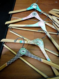 several wooden clothes pins are arranged on a table