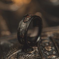 a wedding ring with an intricate design on the inside is shown in this close up photo