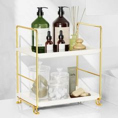 three tiered shelf with soap, lotion and handmade items on white background