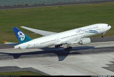 an air new zealand airplane taking off from the runway