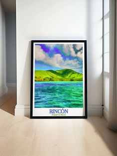 a framed poster is sitting on the floor in front of a window that reads, rincon